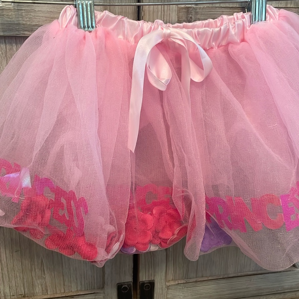 Princess expressions tutu filled with flower petals and the word princess